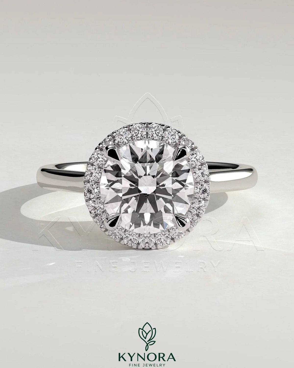 Kynora CJ 2ct round claw solitaire engagement ring with halo and cathedral high setting, showcasing sparkling diamond design.