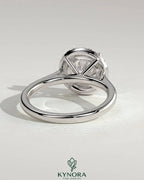 Kynora CJ 2ct round claw solitaire engagement ring with halo and cathedral high setting, showcasing sparkling diamond design.