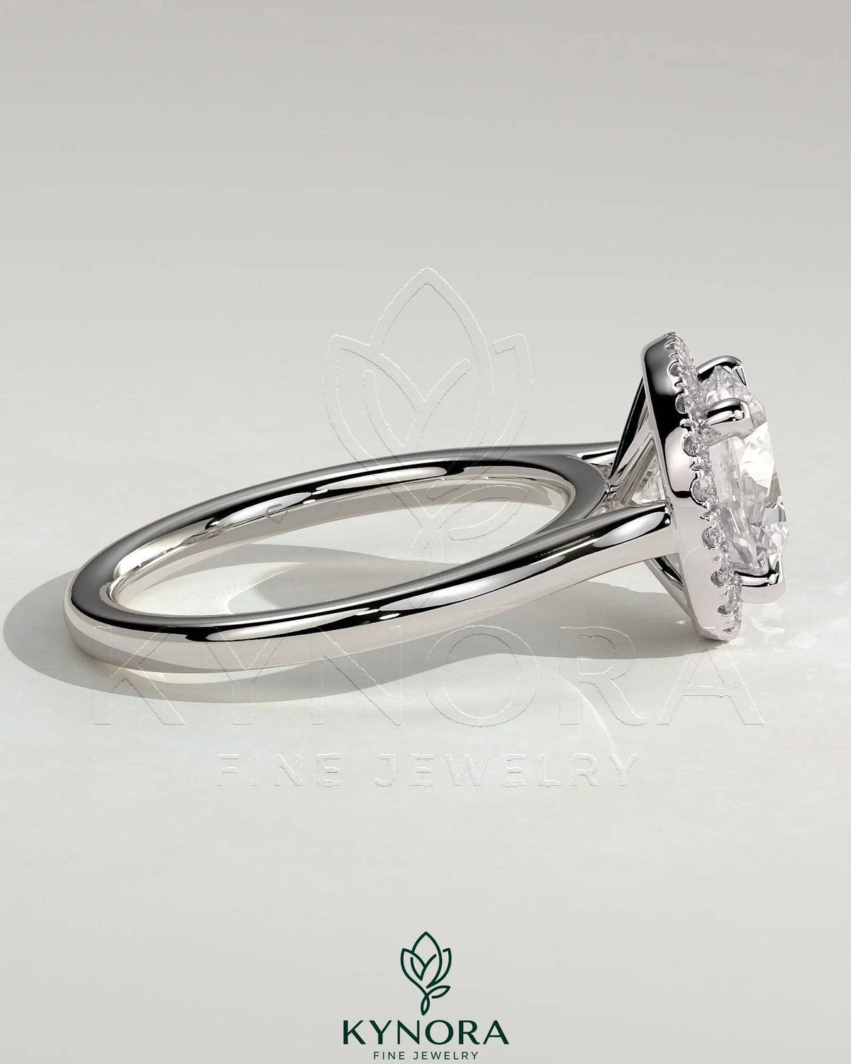 Kynora CJ 2ct round diamond claw solitaire engagement ring with halo and cathedral high setting, showcasing elegant jewelry design.