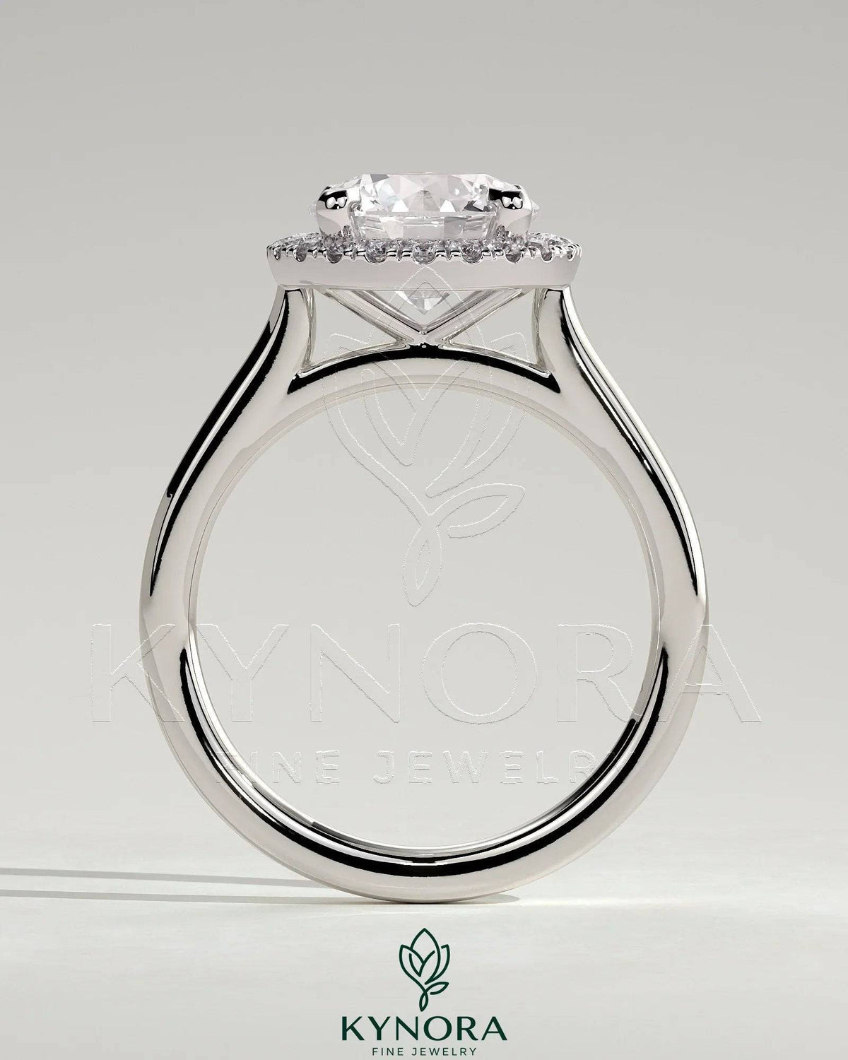 Kynora CJ 2ct round diamond claw solitaire engagement ring with halo and cathedral high setting, showcasing intricate design.