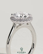 Kynora CJ 2ct round claw solitaire engagement ring with halo and cathedral high setting, showcasing sparkling diamond design.