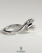Kynora CJ 1ct round and 1.5ct pear-shaped diamond Toi et Moi engagement ring with wave band design