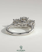 Kynora CJ 2ct round claw trilogy engagement ring with round side stones and trellis gallery design.