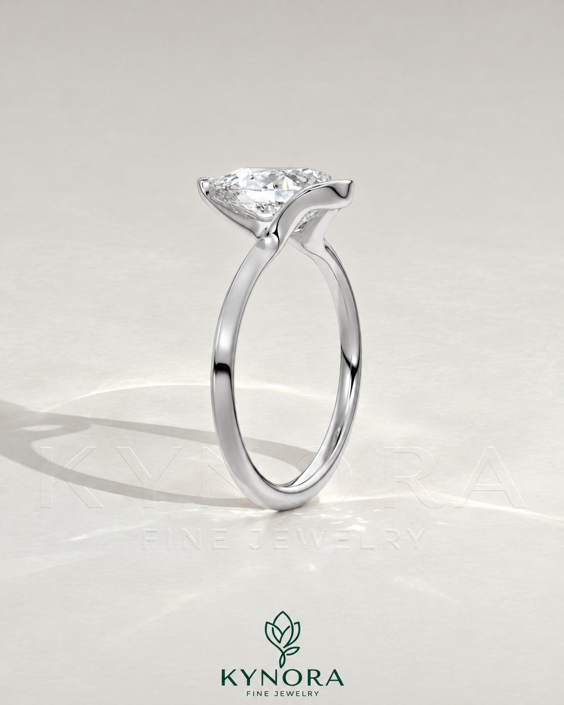 Pear cut moissanite half-bezel engagement ring in 925 silver, featuring a sleek design and detailed craftsmanship.