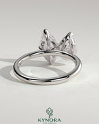 Kynora CJ Toi et Moi engagement ring featuring a 1.8ct pear-shaped and 1.5ct marquise-shaped diamonds in a claw setting