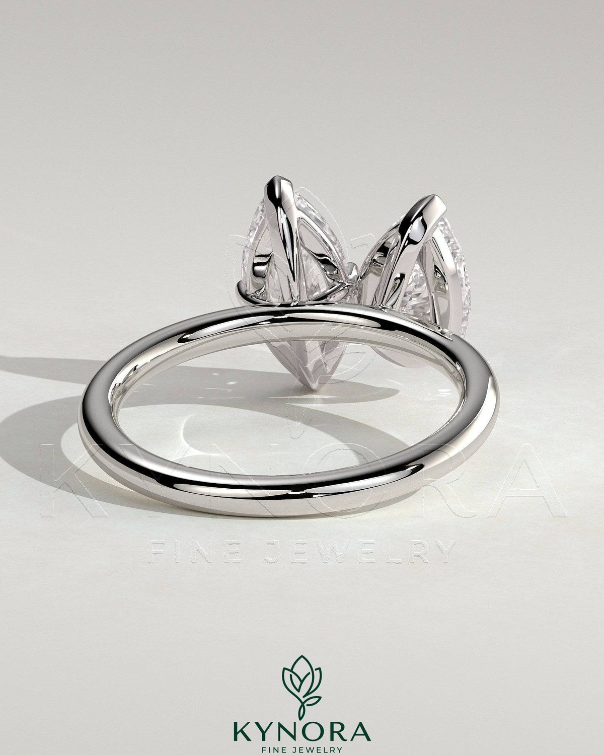 Kynora CJ Toi et Moi engagement ring featuring a 1.8ct pear-shaped and 1.5ct marquise-shaped diamonds in a claw setting