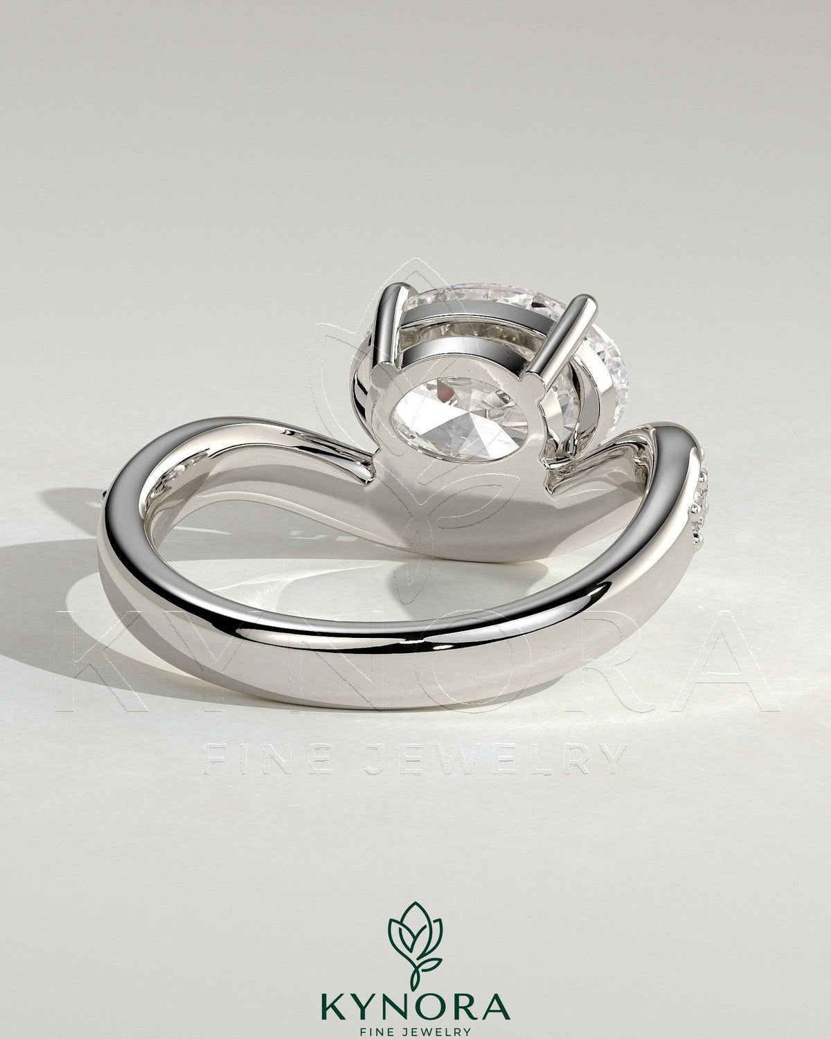 Kynora CJ 2ct oval claw solitaire engagement ring with bead-set pave wave band in east-west setting, showcasing sparkling diamond design.