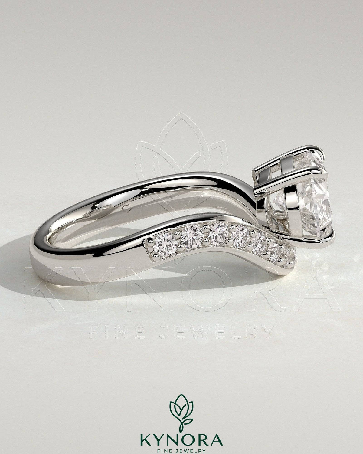 Kynora CJ 2ct oval claw solitaire engagement ring with bead-set pave wave band in east-west setting, elegant and sparkling jewelry.