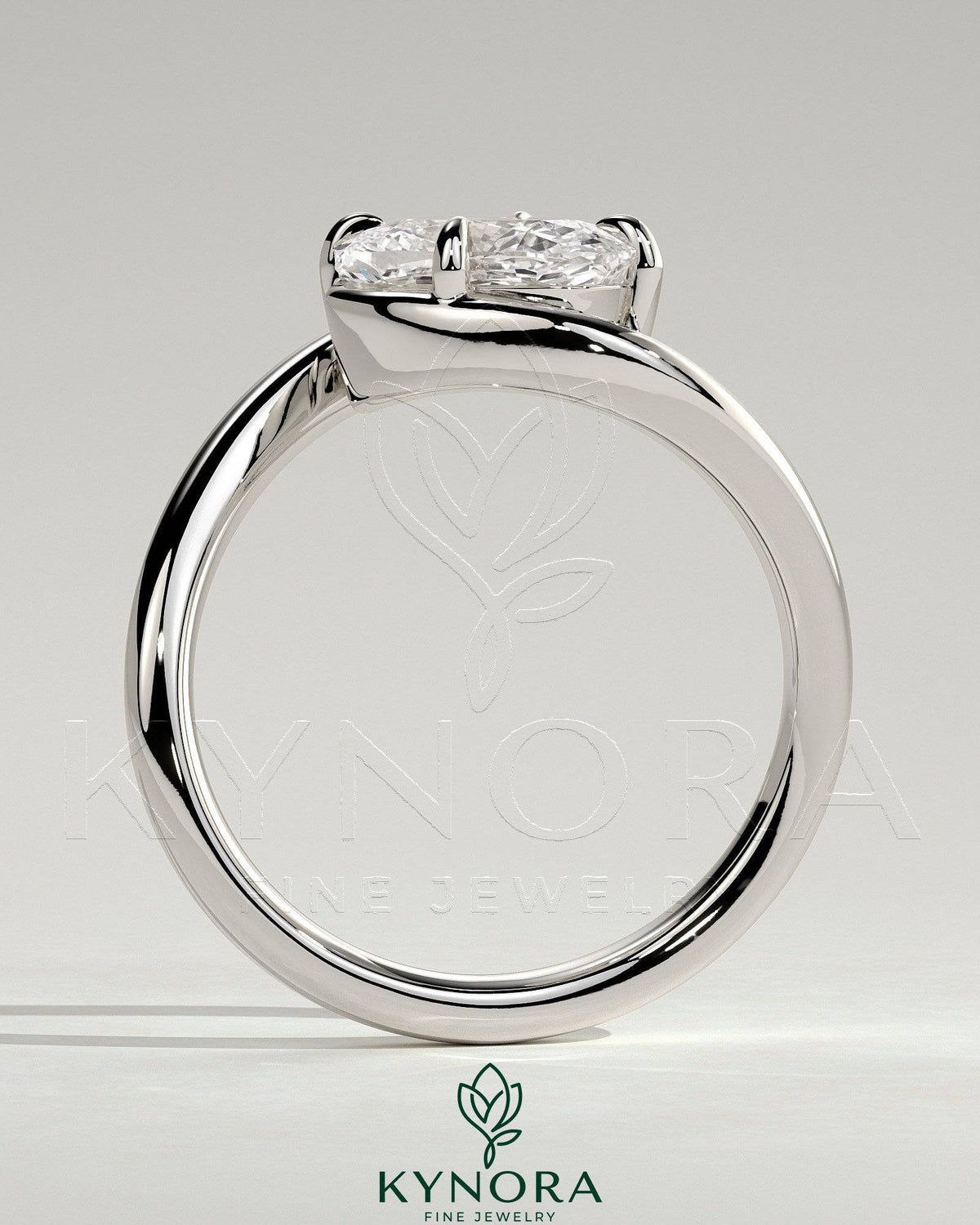 Elegant 2ct East-West Elongated Cushion Claw Solitaire engagement ring with bypass band by Kynora CJ, showcasing intricate design details.