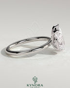Kynora CJ Toi et Moi engagement ring with 1.8ct pear-shaped and 1.5ct marquise-shaped diamonds, set in a stylish claw design.