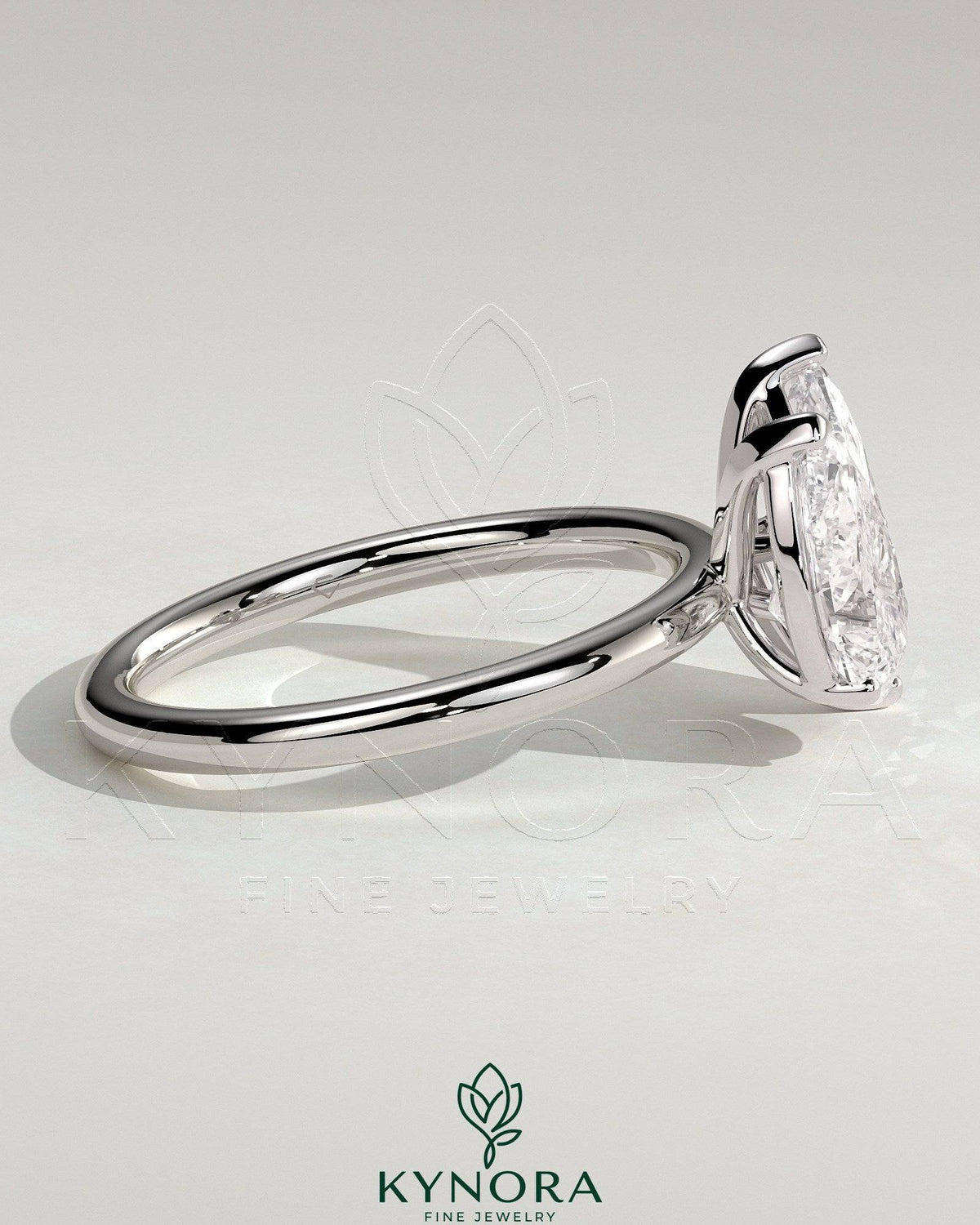 Kynora CJ Toi et Moi engagement ring with 1.8ct pear-shaped and 1.5ct marquise-shaped diamonds, set in a stylish claw design.