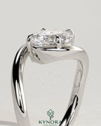 Kynora CJ 2ct elongated cushion cut diamond engagement ring with east-west setting and bypass band design.