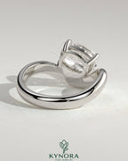 Kynora CJ 2ct elongated cushion cut diamond engagement ring with east-west setting and wave band design.