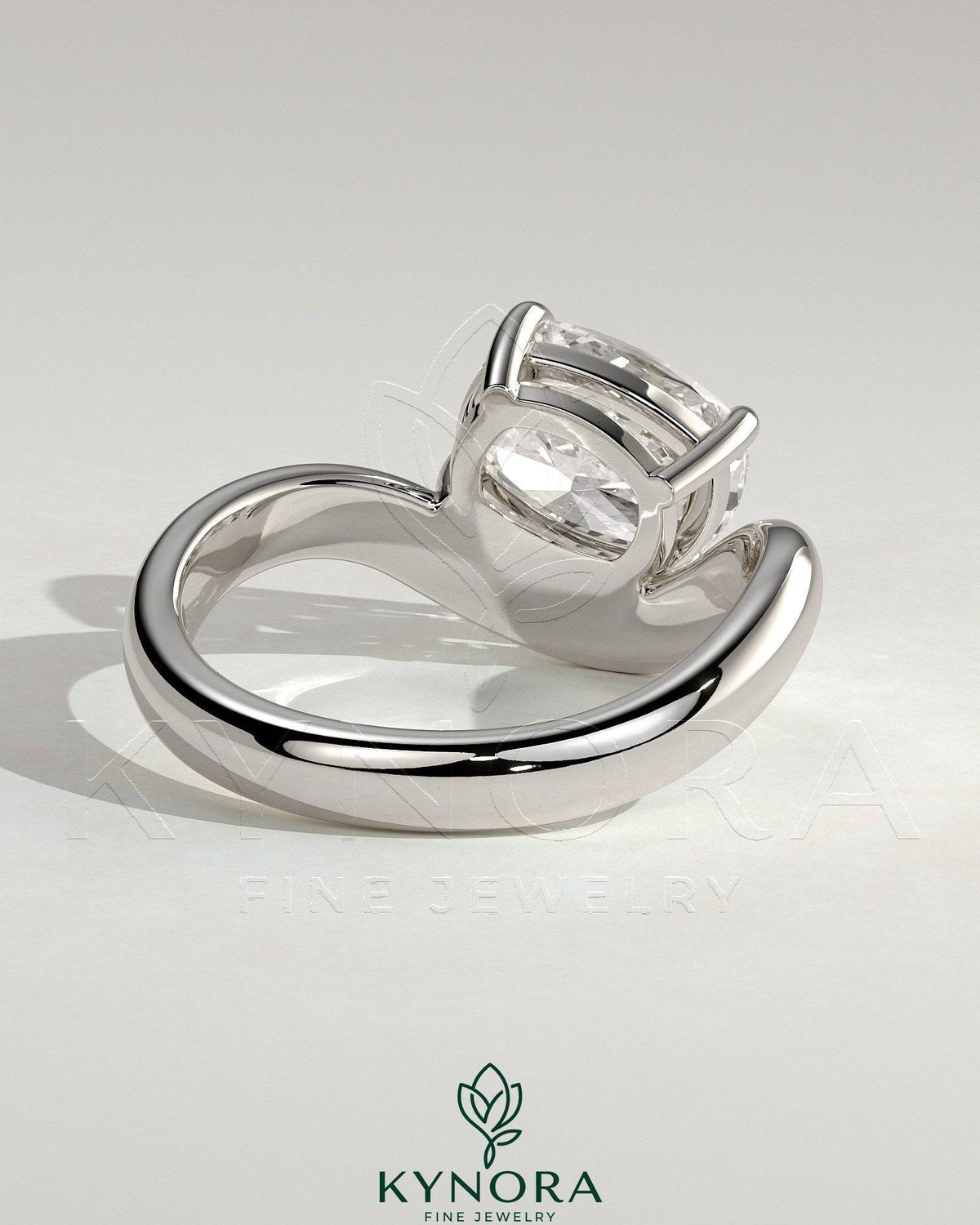 Kynora CJ 2ct elongated cushion cut diamond engagement ring with east-west setting and wave band design.