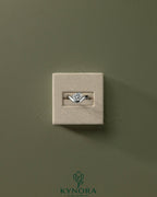 Kynora CJ 2ct elongated cushion cut diamond solitaire engagement ring with east-west setting and wave band design.