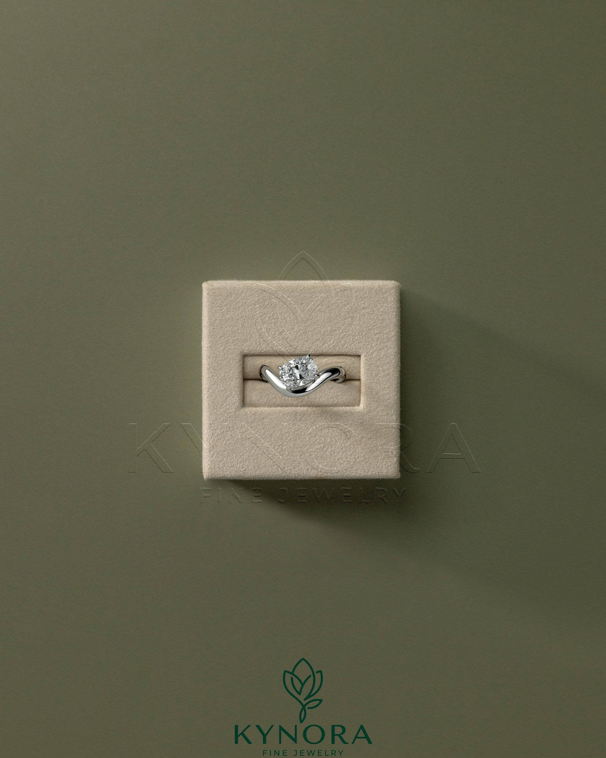 Kynora CJ 2ct elongated cushion cut diamond solitaire engagement ring with east-west setting and wave band design.
