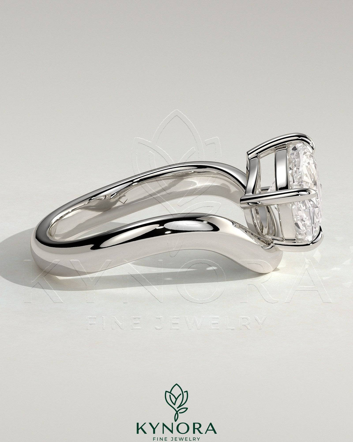 Kynora CJ 2ct elongated cushion cut diamond engagement ring with east-west setting and wave band design on a silver band.