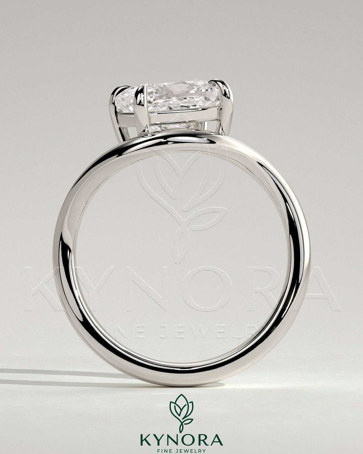 Kynora CJ 2ct elongated cushion cut diamond engagement ring with east-west setting and wave band design.