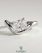 Kynora CJ 2ct elongated cushion cut diamond East-West claw engagement ring with wave band design, showcasing elegant craftsmanship.