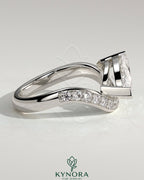Kynora CJ 2ct marquise claw solitaire engagement ring with bead-set pave wave band in east-west setting.