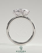 Kynora CJ Toi et Moi engagement ring featuring a 1.8ct pear-shaped and 1.5ct marquise-shaped diamonds set in a claw design.