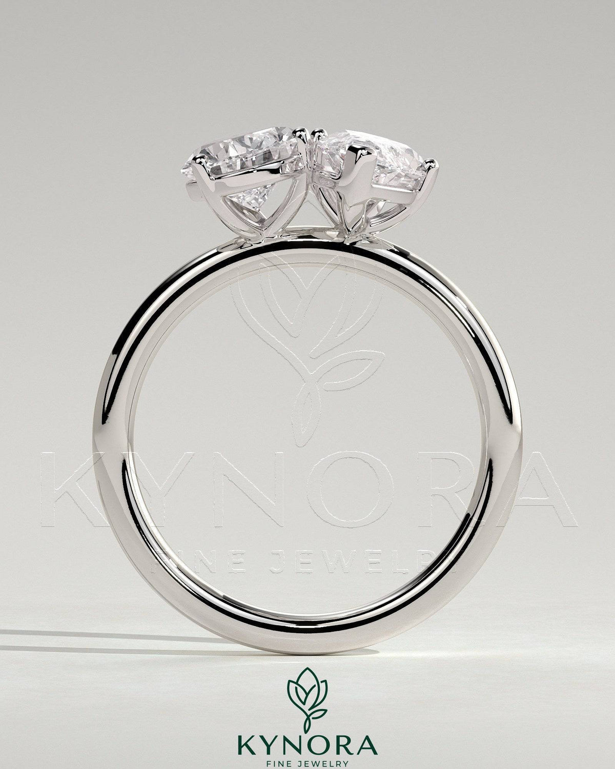 Kynora CJ Toi et Moi engagement ring featuring a 1.8ct pear-shaped and 1.5ct marquise-shaped diamonds set in a claw design.