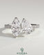 Kynora CJ Toi et Moi engagement ring with 1.5ct marquise and 1.8ct pear-shaped diamonds, pave band, cathedral setting.