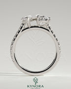 Kynora CJ Toi et Moi engagement ring with 1.5ct marquise and 1.8ct pear-shaped diamonds, pavé band, and cathedral setting