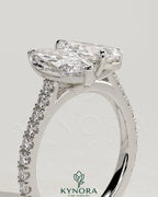 Kynora CJ Toi et Moi engagement ring featuring 1.5ct marquise and 1.8ct pear-shaped diamonds with pave band and cathedral setting