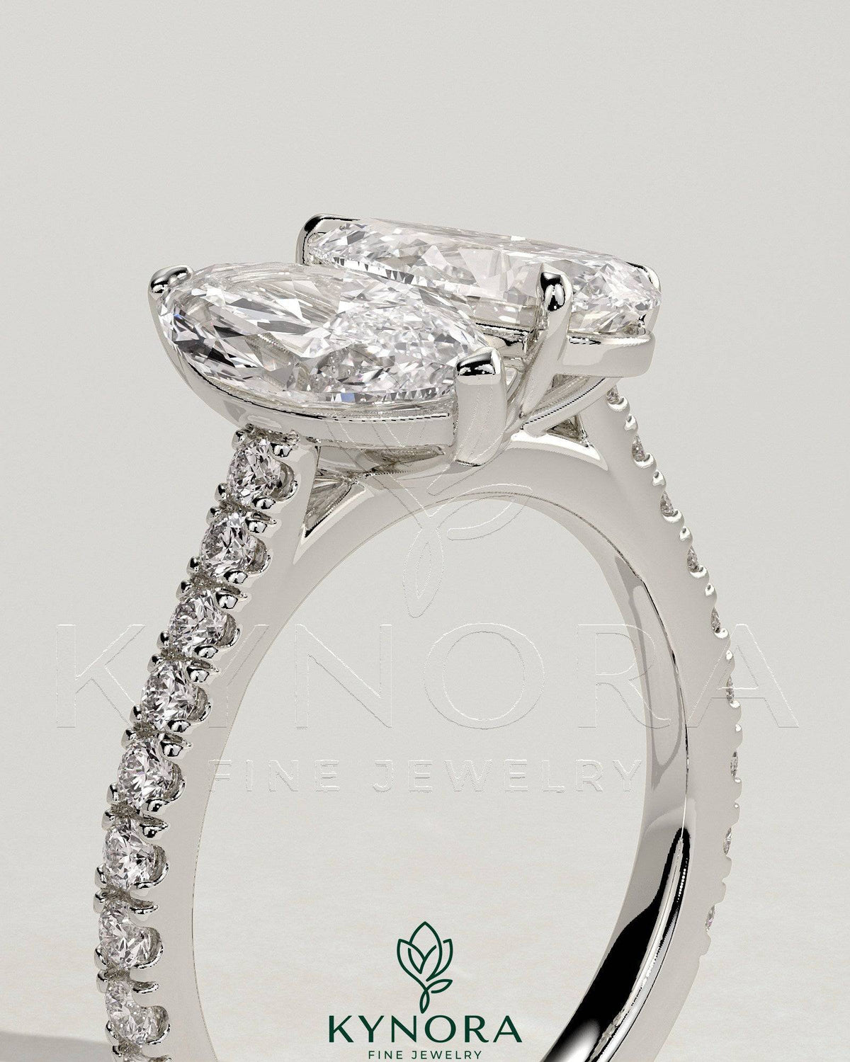 Kynora CJ Toi et Moi engagement ring featuring 1.5ct marquise and 1.8ct pear-shaped diamonds with pave band and cathedral setting