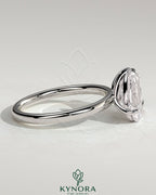 Kynora CJ Toi et Moi engagement ring with 1.65ct pear-shaped and 1.65ct princess-cut diamonds in a claw setting.