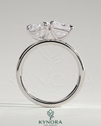 Kynora CJ Toi et Moi engagement ring featuring 1.65ct pear-shaped and 1.65ct princess-cut diamonds in a claw setting.