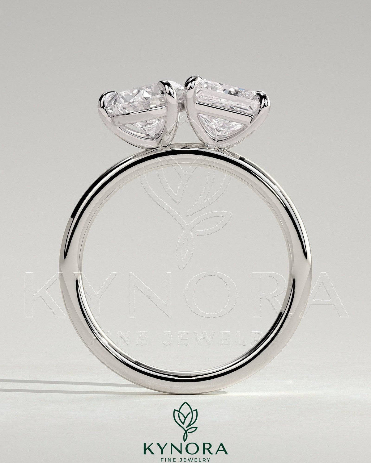 Kynora CJ Toi et Moi engagement ring featuring 1.65ct pear-shaped and 1.65ct princess-cut diamonds in a claw setting.