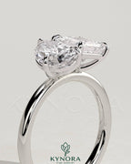 Kynora CJ Toi et Moi engagement ring featuring 1.65ct pear-shaped and 1.65ct princess-cut diamonds with claw settings.