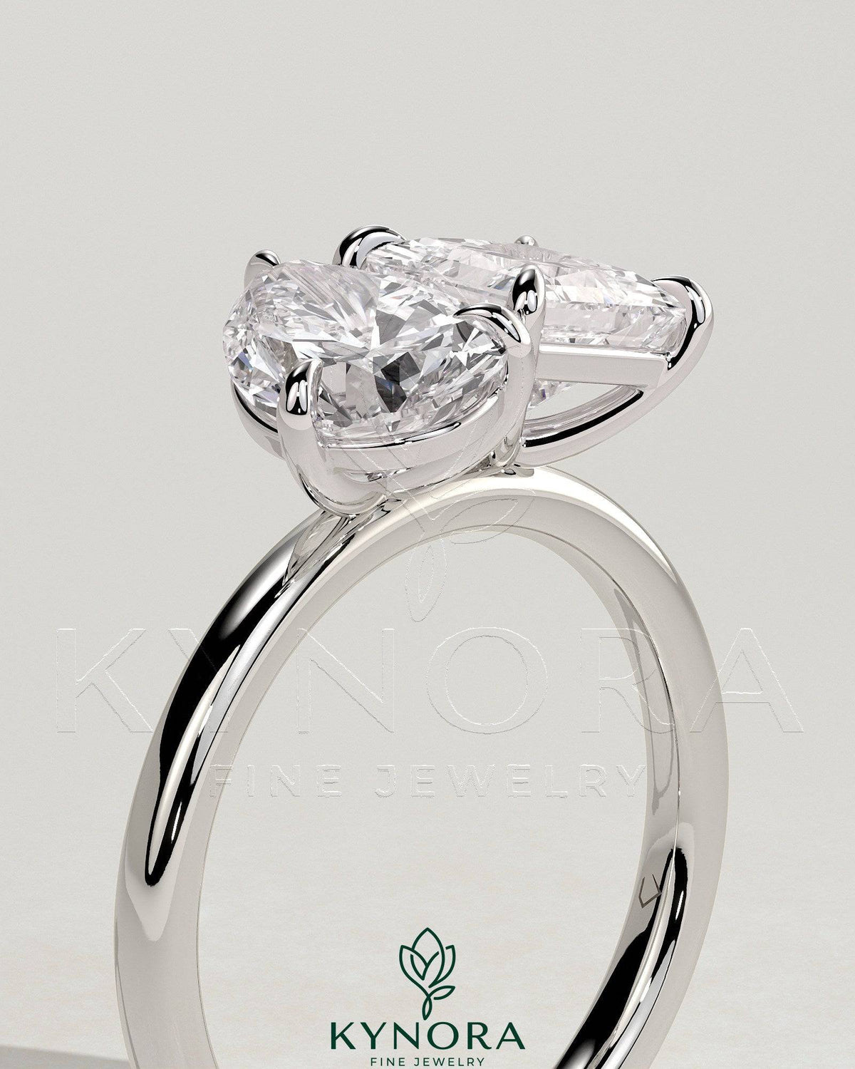 Kynora CJ Toi et Moi engagement ring featuring 1.65ct pear-shaped and 1.65ct princess-cut diamonds with claw settings.
