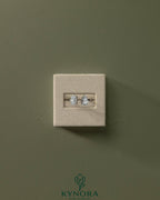 Kynora CJ Toi et Moi engagement ring with 1.23ct oval and 1.15ct pear-shaped diamonds on an open band.