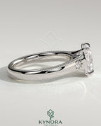 Vintage style 2ct elongated cushion bezel engagement ring with star accent stones, milgrain detailing, and tapered band by Kynora CJ
