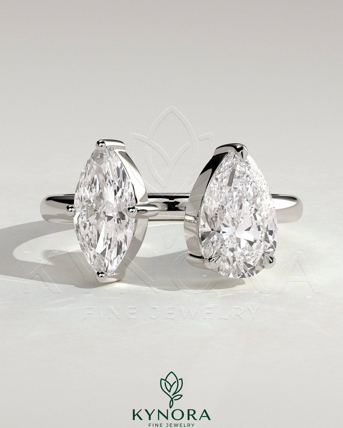 Kynora CJ Toi et Moi engagement ring with 1.15ct marquise and 1.65ct pear-shaped diamonds on open band setting Imagen principal del producto