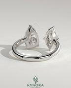Kynora CJ Toi et Moi engagement ring with 1.15ct marquise and 1.65ct pear-shaped diamonds on open band design.