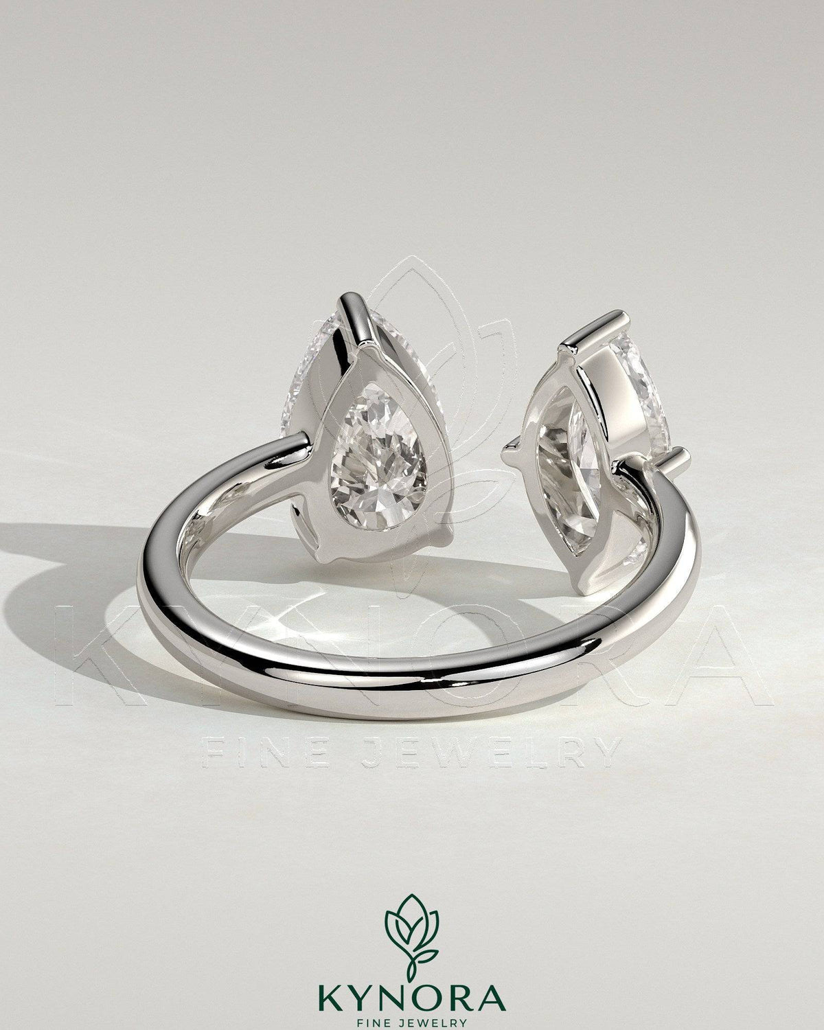 Kynora CJ Toi et Moi engagement ring with 1.15ct marquise and 1.65ct pear-shaped diamonds on open band design.