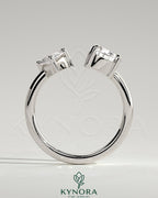 Kynora CJ Toi et Moi engagement ring with 1.15ct marquise and 1.65ct pear-shaped diamonds on open band design.