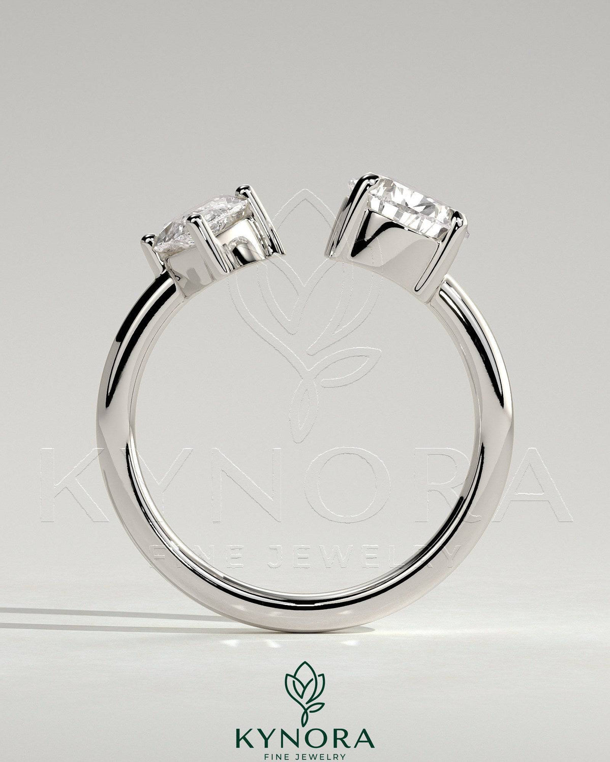 Kynora CJ Toi et Moi engagement ring with 1.15ct marquise and 1.65ct pear-shaped diamonds on open band design.
