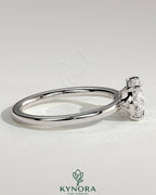 Kynora CJ 2ct oval east-west claw solitaire engagement ring with raised basket gallery, featuring a sparkling diamond setting.