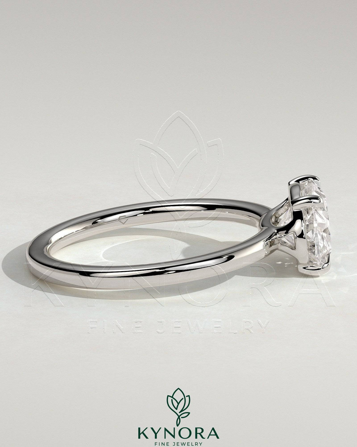 Kynora CJ 2ct oval east-west claw solitaire engagement ring with raised basket gallery, featuring a sparkling diamond setting.