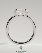 Kynora CJ 2ct oval east-west claw solitaire engagement ring with raised basket gallery showcasing elegant diamond setting.