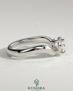 Kynora CJ 2ct pear-shaped east-west diamond solitaire engagement ring with wave band in silver finish.