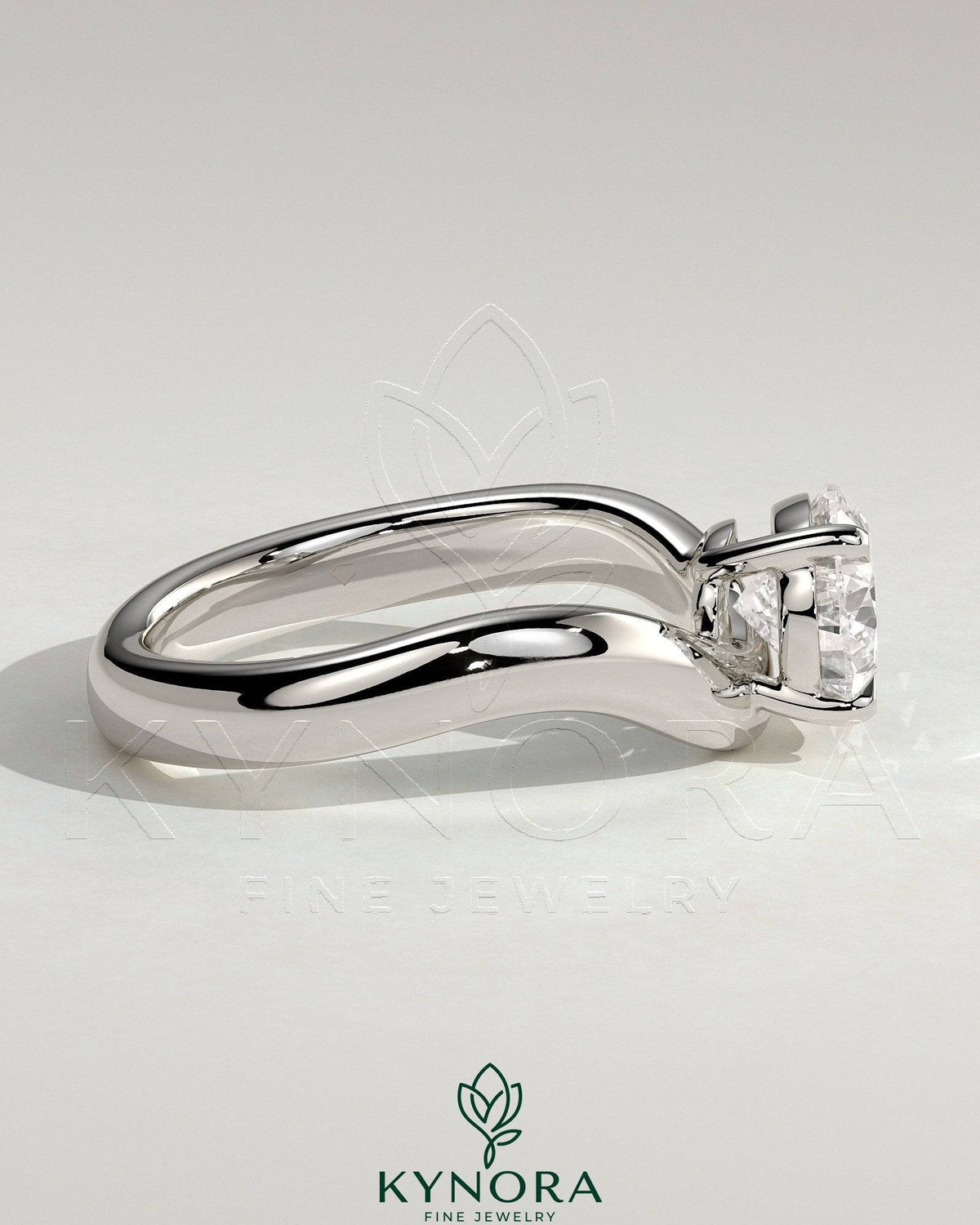 Kynora CJ 2ct pear-shaped east-west diamond solitaire engagement ring with wave band in silver finish.
