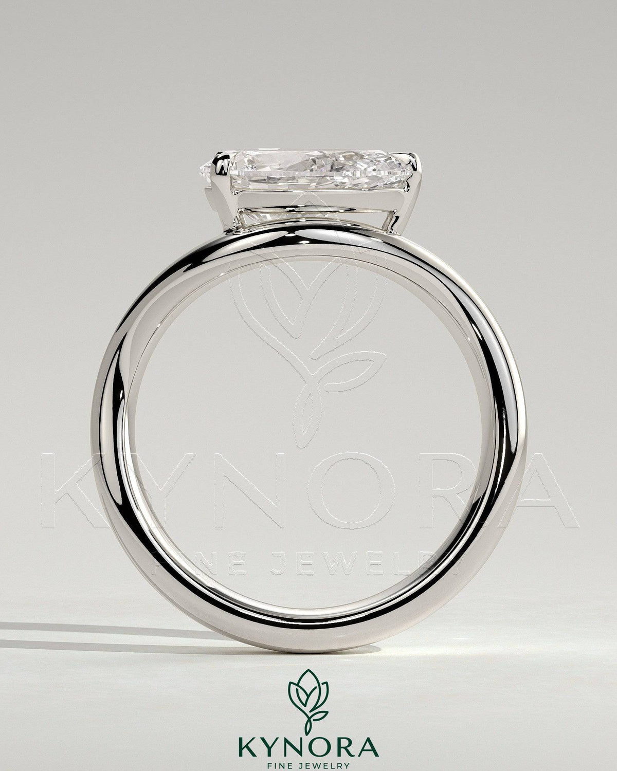 Kynora CJ 2ct pear-shaped east-west diamond solitaire engagement ring with wave band design, showcasing elegant jewelry craftsmanship.