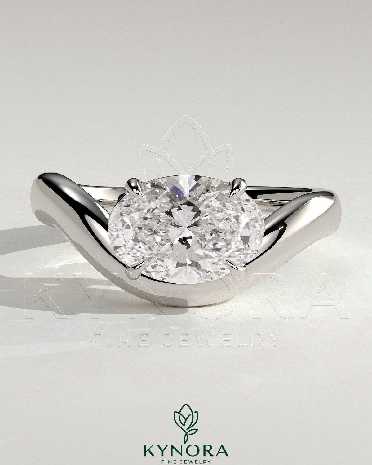 East-West 2ct oval diamond solitaire engagement ring with wave band by Kynora CJ showing the ring's design and sparkling stone. Main image