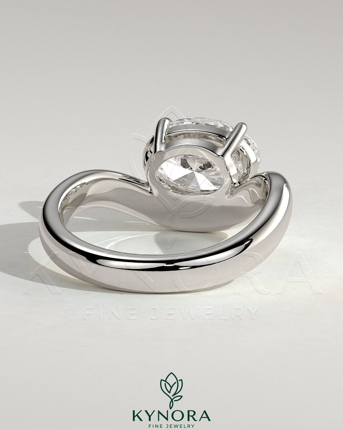 Kynora CJ 2ct oval east-west claw solitaire engagement ring with wave band showcasing sparkling diamond and elegant design